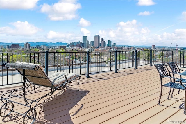 wooden terrace with a view of city