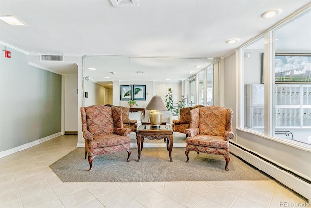 living area featuring visible vents, baseboard heating, light tile patterned floors, baseboards, and ornamental molding