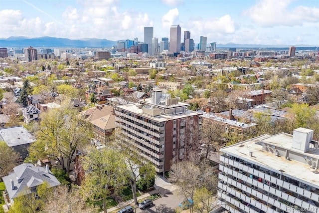 drone / aerial view featuring a view of city and a mountain view