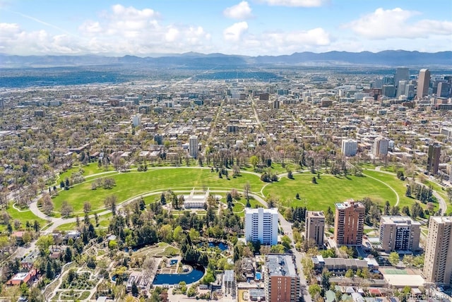 drone / aerial view featuring a city view and a mountain view