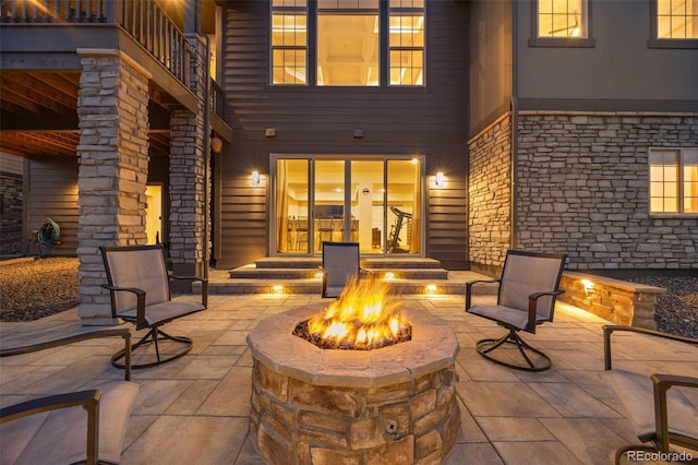 view of patio / terrace with an outdoor fire pit