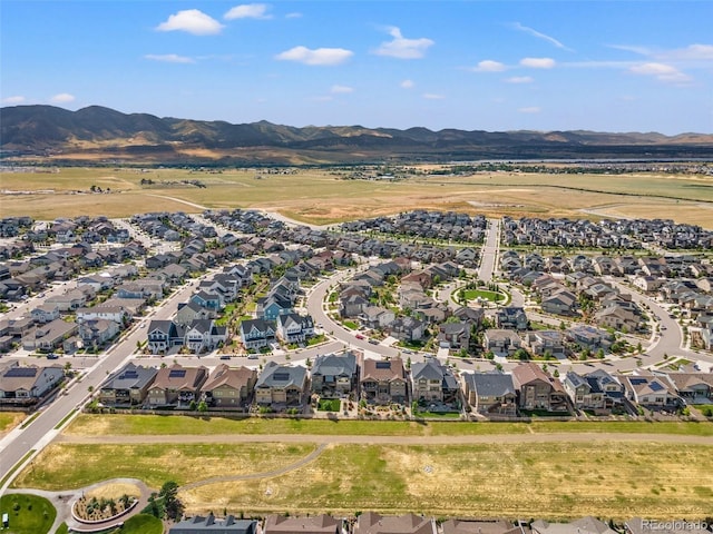 birds eye view of property featuring a mountain view