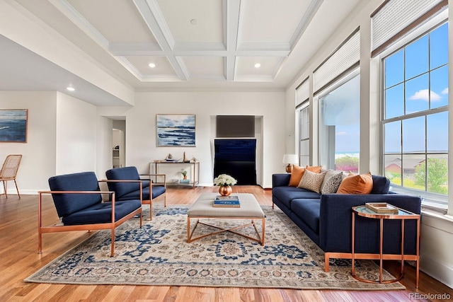 living room with crown molding, wood-type flooring, coffered ceiling, and beam ceiling