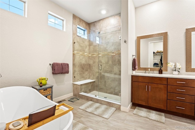 bathroom with vanity and plus walk in shower