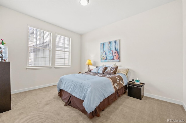 bedroom with light colored carpet