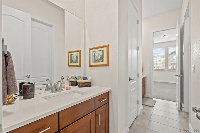 bathroom featuring tile patterned flooring and vanity