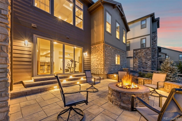 patio terrace at dusk with an outdoor fire pit