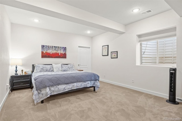 bedroom featuring light colored carpet