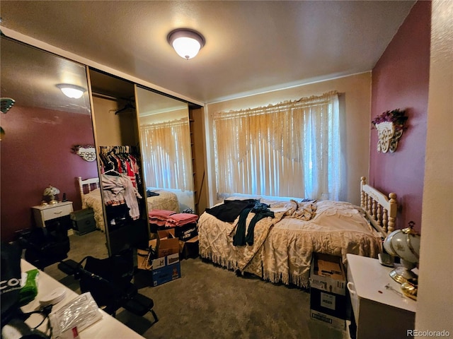 bedroom with carpet floors and a closet