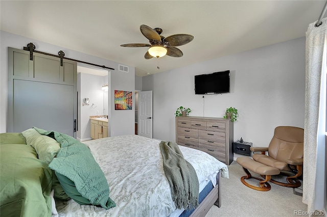 675 W 171st Pl, Broomfield, CO 80023 - bedroom featuring a barn door, light colored carpet, connected bathroom, and ceiling fan