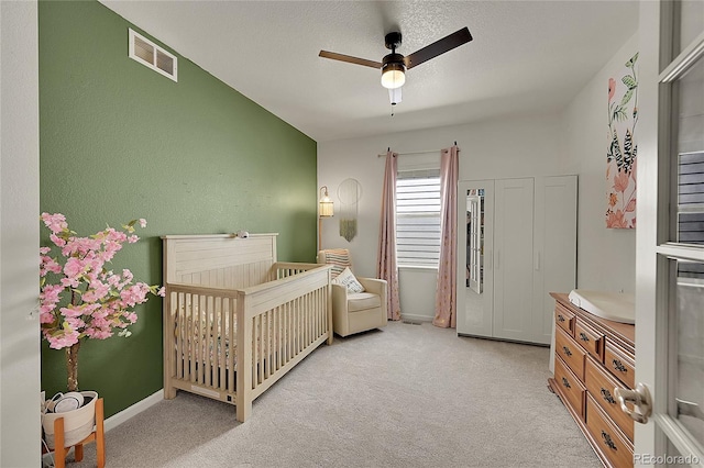 675 W 171st Pl, Broomfield, CO 80023 - bedroom with a crib, light carpet, and ceiling fan