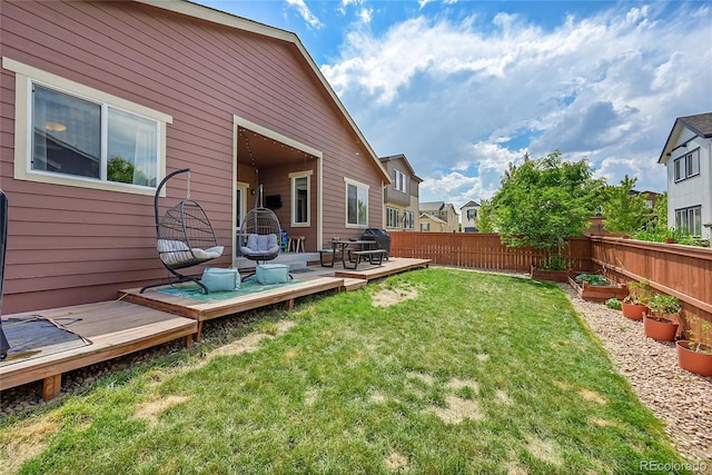 675 W 171st Pl, Broomfield, CO 80023 - fenced yard with a wooden deck and a vegetable garden