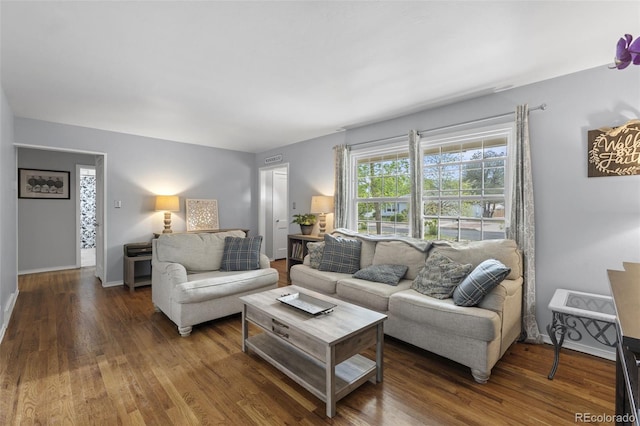 2415 N Logan Ave, Colorado Springs, CO 80907 - living area featuring wood finished floors and baseboards