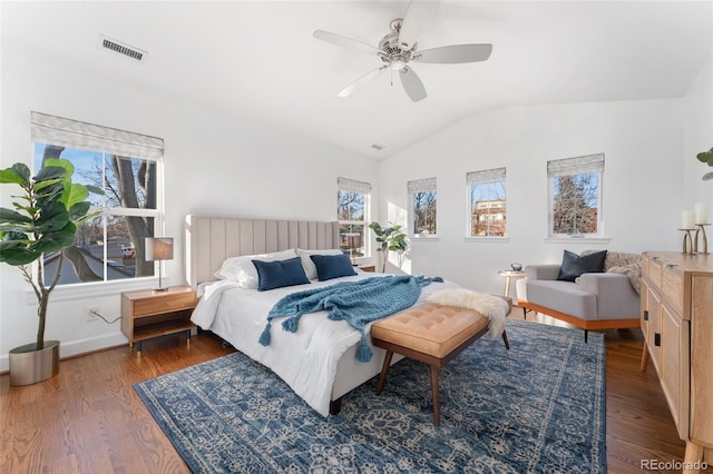 bedroom featuring vaulted ceiling, dark wood-type flooring, and ceiling fan