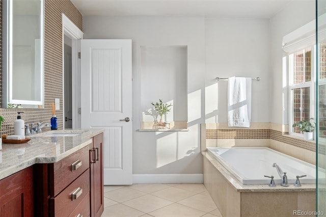 bathroom with tasteful backsplash, vanity, tiled bath, and tile patterned floors