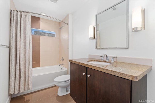 full bathroom featuring vanity, toilet, tile patterned flooring, and shower / bath combo with shower curtain