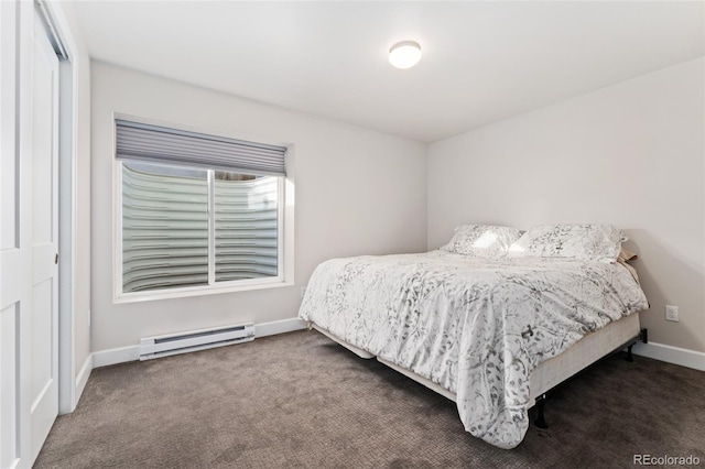 carpeted bedroom with baseboard heating