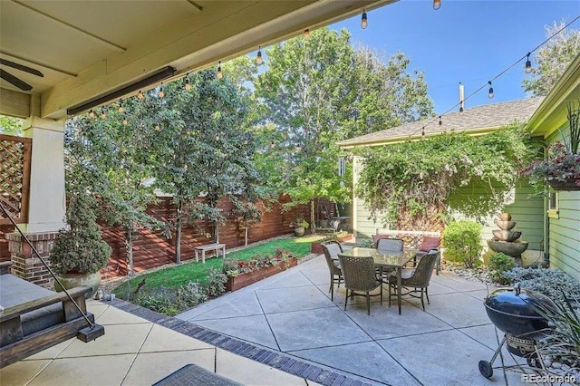 view of patio / terrace featuring a grill and ceiling fan