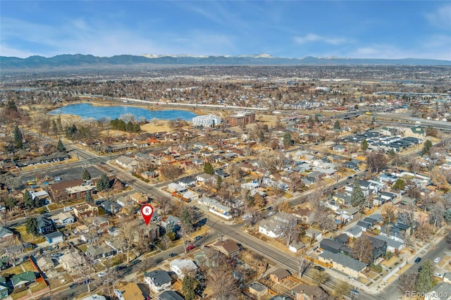 drone / aerial view with a water and mountain view