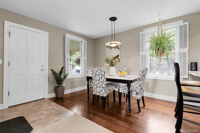 503 15th St, Golden, CO 80401 - dining space with plenty of natural light, baseboards, and wood finished floors