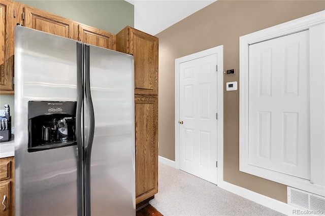 503 15th St, Golden, CO 80401 - kitchen with stainless steel fridge with ice dispenser, brown cabinets, baseboards, and light countertops