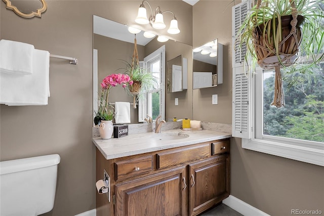 503 15th St, Golden, CO 80401 - half bathroom featuring vanity, toilet, and baseboards