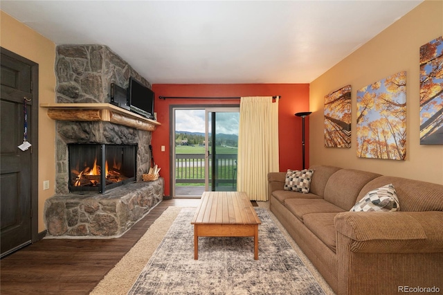 397 County Road 834 Unit 8, Fraser, CO 80442 - living room featuring wood finished floors and a stone fireplace
