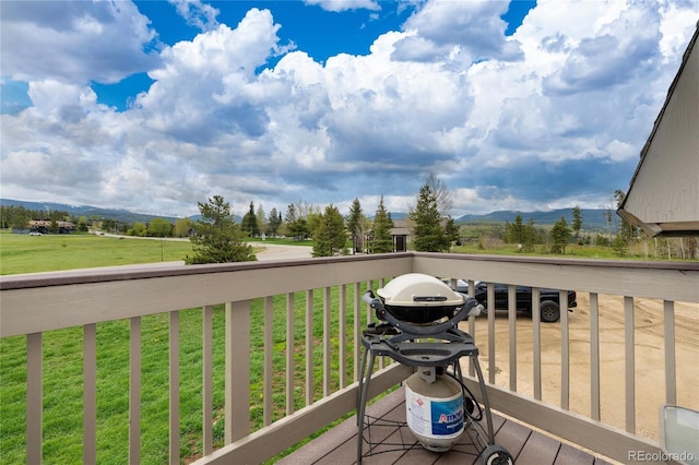 397 County Road 834 Unit 8, Fraser, CO 80442 - wooden terrace featuring a mountain view and a lawn