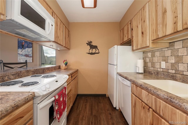 397 County Road 834 Unit 8, Fraser, CO 80442 - kitchen with white appliances, decorative backsplash, dark wood-style flooring, baseboards, and light countertops