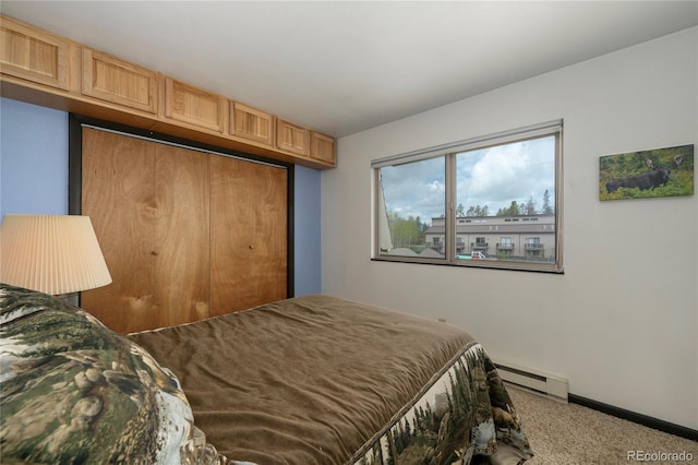 397 County Road 834 Unit 8, Fraser, CO 80442 - bedroom with a baseboard heating unit, carpet flooring, baseboards, and a closet