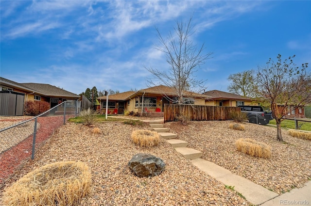 3211 Olive St, Denver, CO 80207 - single story home featuring a gate and fence