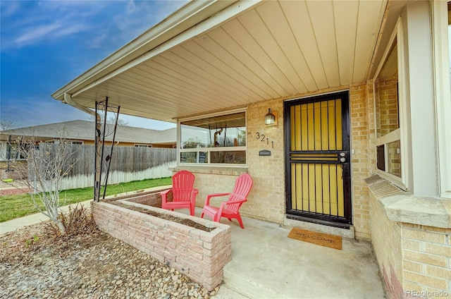 3211 Olive St, Denver, CO 80207 - entrance to property featuring brick siding and fence