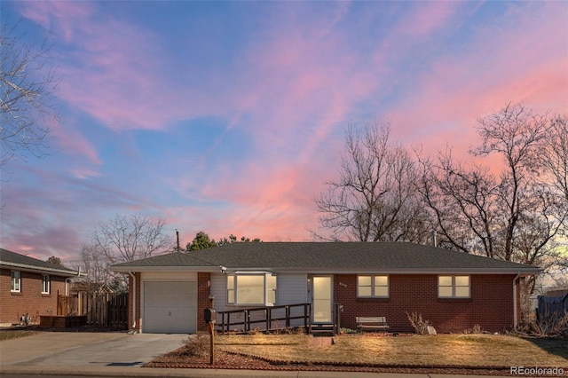 ranch-style house featuring a garage