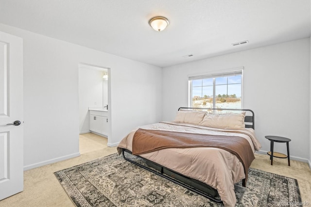 bedroom with light colored carpet