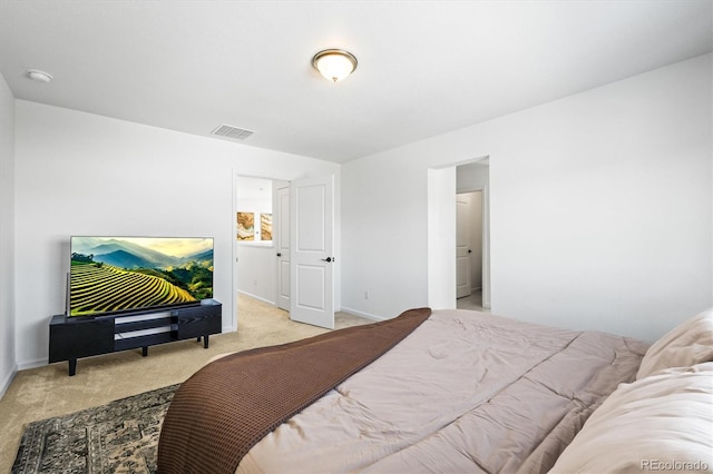 bedroom with light colored carpet