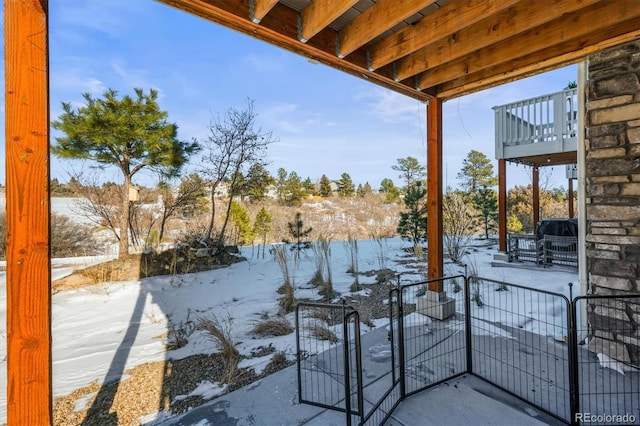 view of snow covered patio