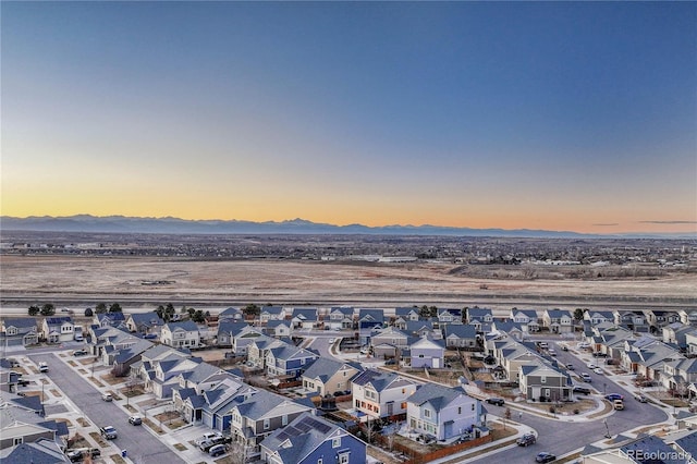 drone / aerial view featuring a mountain view and a residential view