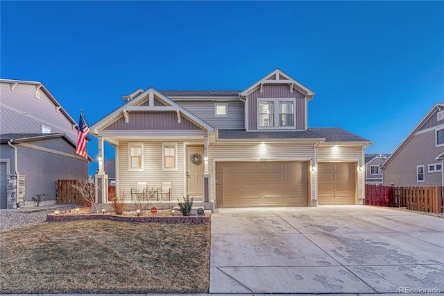 craftsman house with a garage, covered porch, fence, and concrete driveway