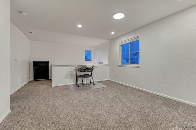 unfurnished office featuring carpet floors, baseboards, and recessed lighting