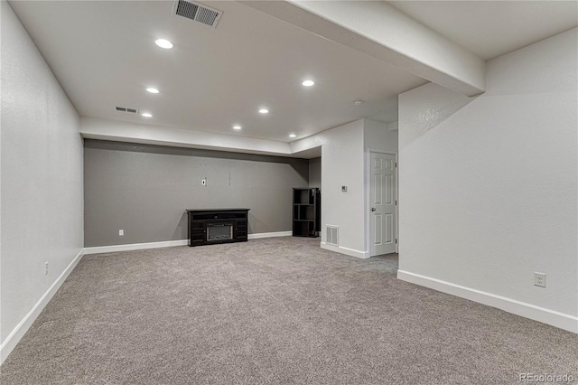 basement featuring visible vents and recessed lighting