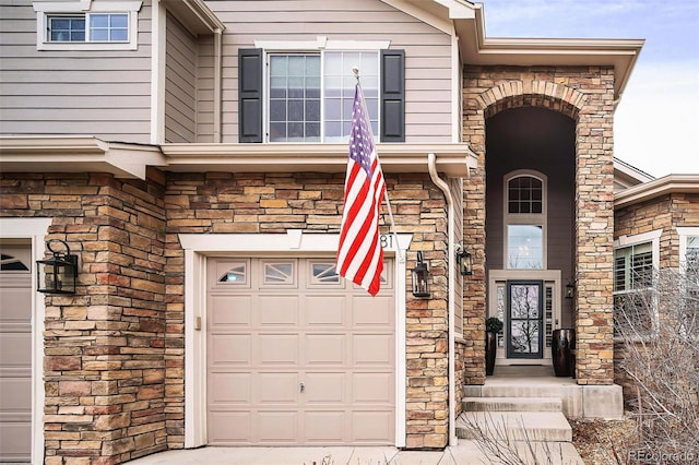 doorway to property featuring a garage