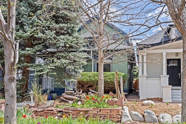 2514 N Humboldt St, Denver, CO 80205 - view of home's exterior featuring a shingled roof