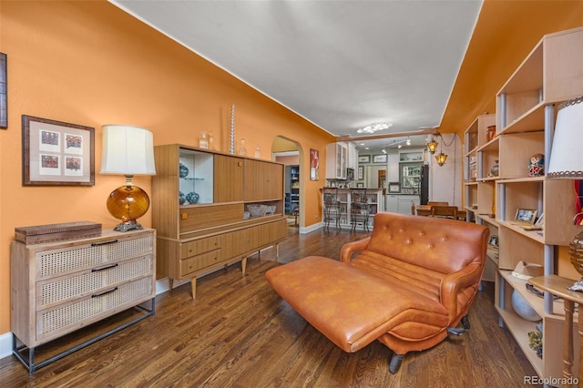 2514 N Humboldt St, Denver, CO 80205 - sitting room with arched walkways, wood finished floors, and baseboards