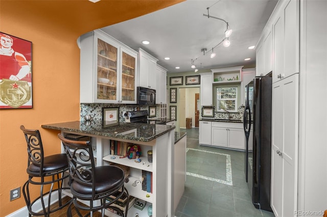 2514 N Humboldt St, Denver, CO 80205 - kitchen with open shelves, black appliances, tasteful backsplash, a peninsula, and recessed lighting