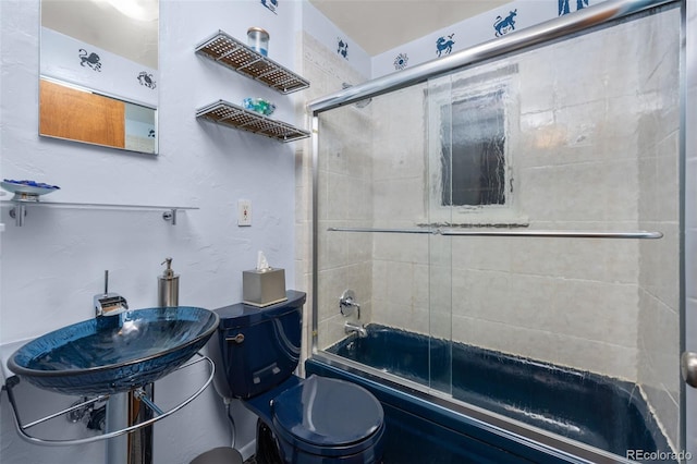 2514 N Humboldt St, Denver, CO 80205 - bathroom with combined bath / shower with glass door, toilet, and a sink