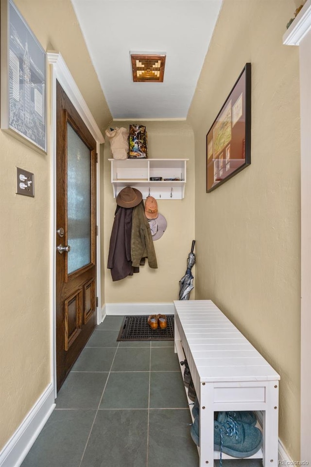 2514 N Humboldt St, Denver, CO 80205 - mudroom featuring dark tile patterned flooring and baseboards