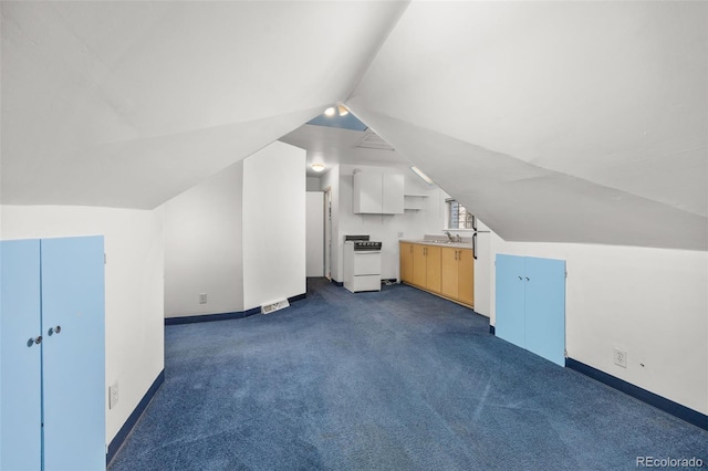 2514 N Humboldt St, Denver, CO 80205 - bonus room with vaulted ceiling, dark carpet, baseboards, and a sink