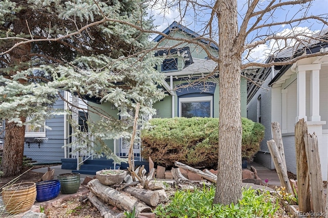 2514 N Humboldt St, Denver, CO 80205 - view of side of property with a shingled roof