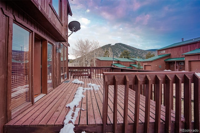 wooden deck with a mountain view