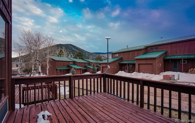 wooden deck featuring a mountain view